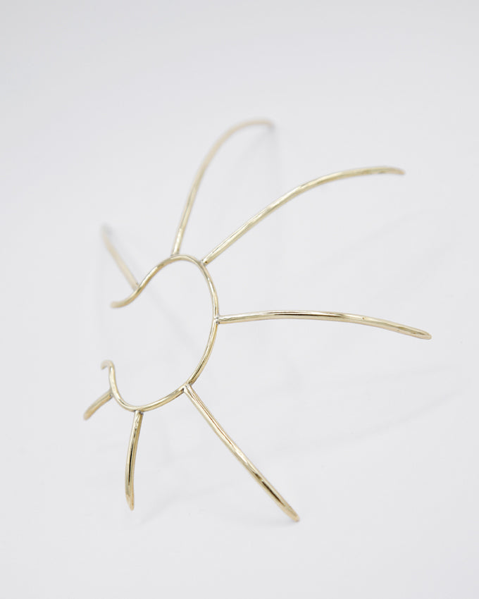 large ear cuff jewelry, adapts around the ear with long spikes to fit the courbature of the head