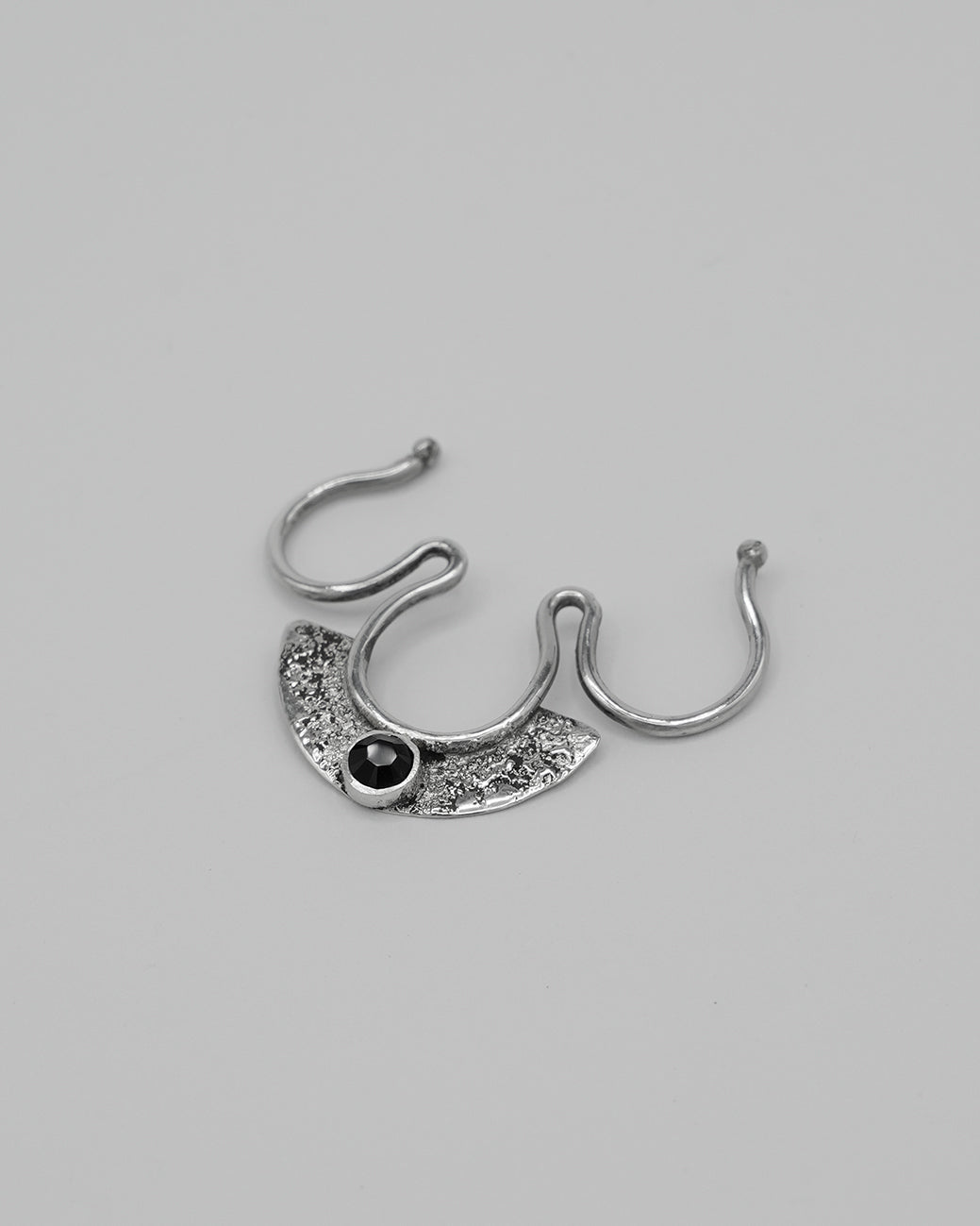Handmade silver fake septum ring with black Swarovski crystal detail.