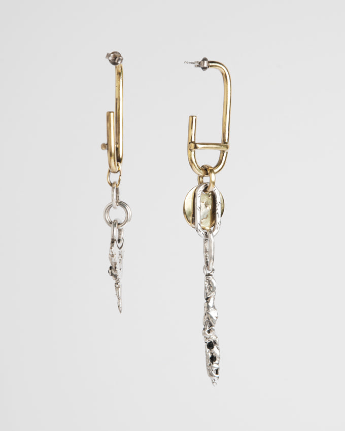 A pair of asymetrical earrings handcrafted