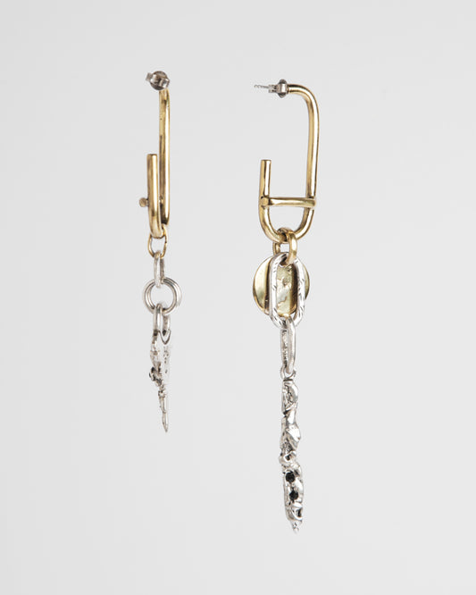 A pair of asymetrical earrings handcrafted
