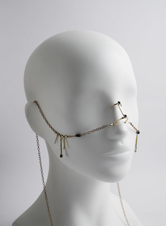 bridge nose type jewelry with chains and pendants.