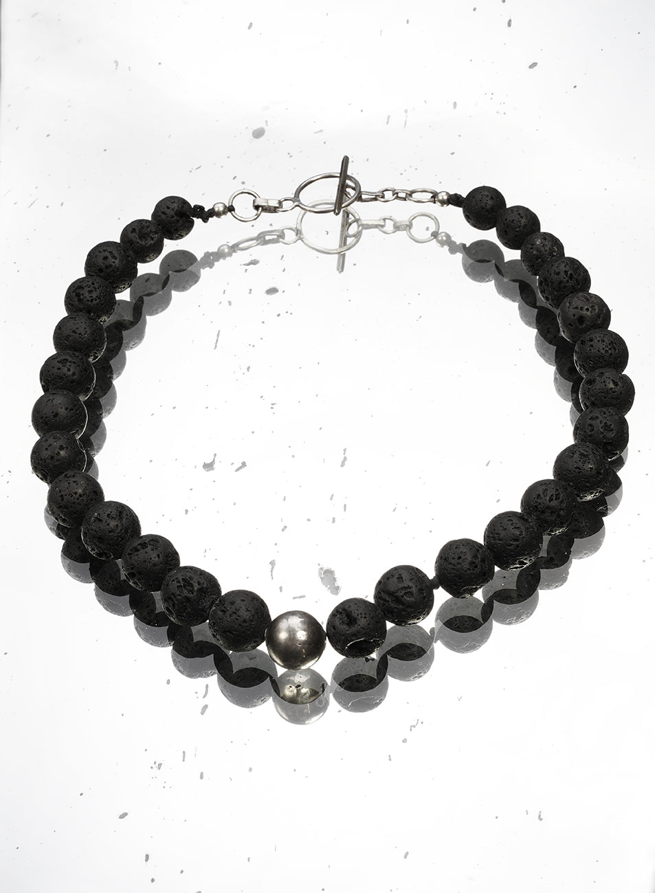 short necklace with silver and volcanic stones