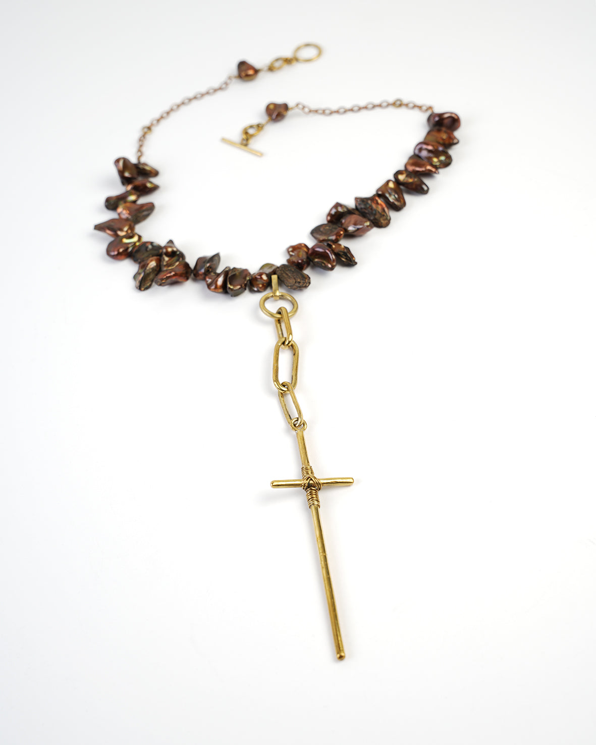 beautiful cross pendant on short necklace mounted with pearls