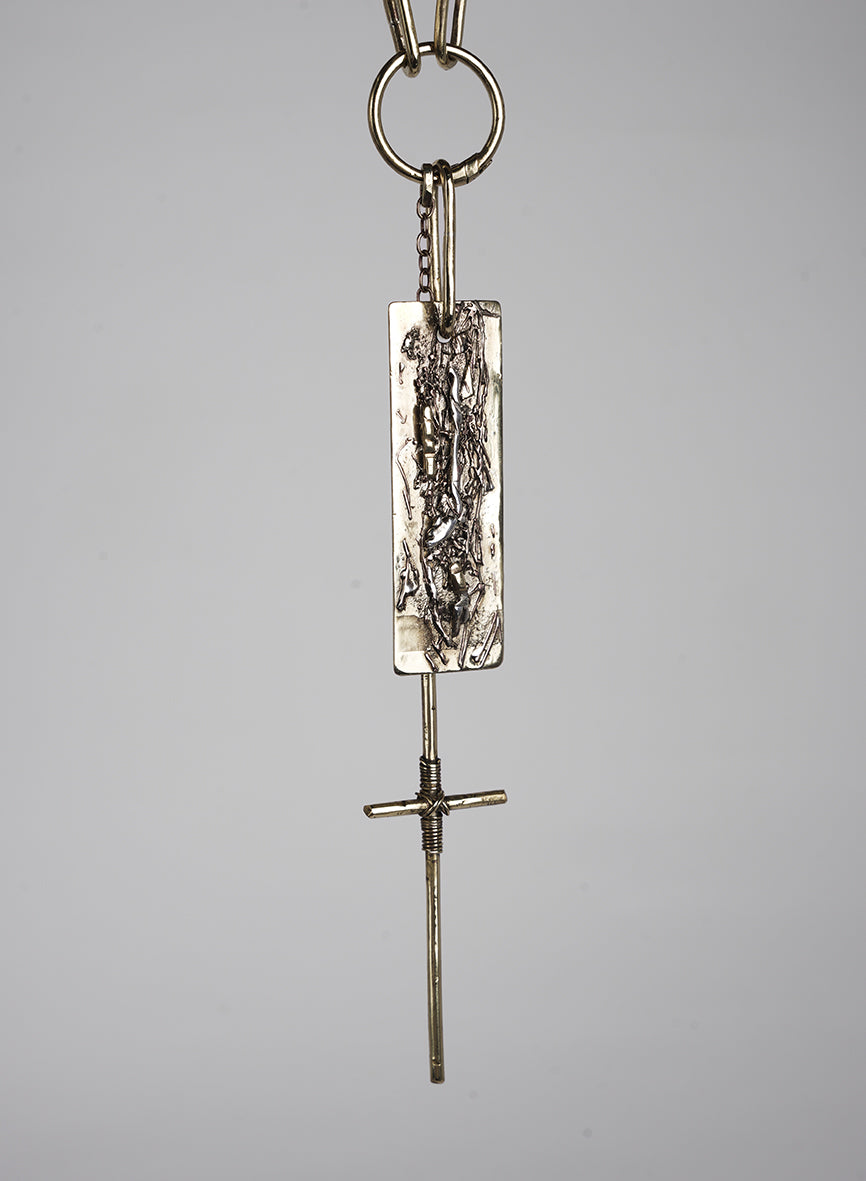 Long necklace made of leather and gold-tone metal with pendants and cross embellishment