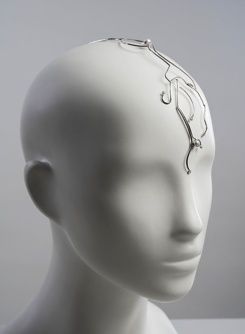 face jewelry that fit as a headpiece, modern and futuristic design in silver