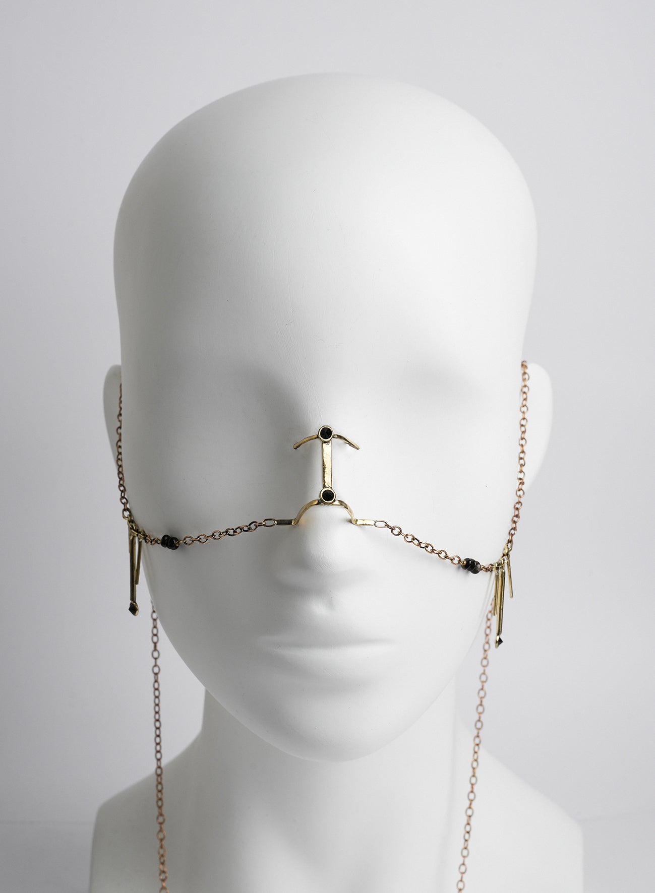 facial golden jewelry with chains, and stones, golden color