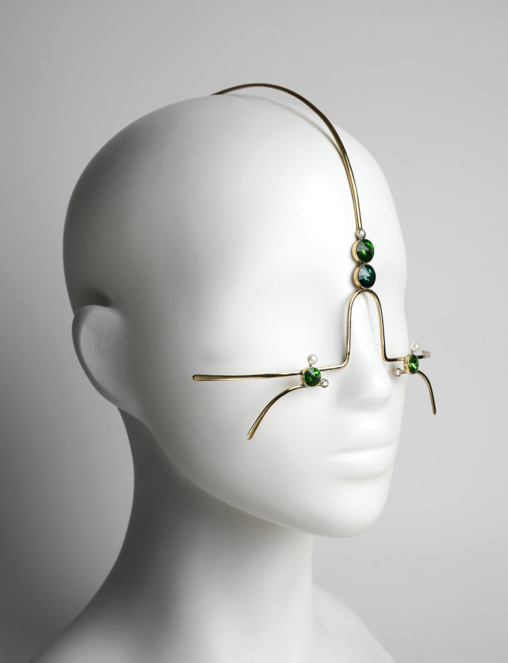 gold headpiece and face jewelry