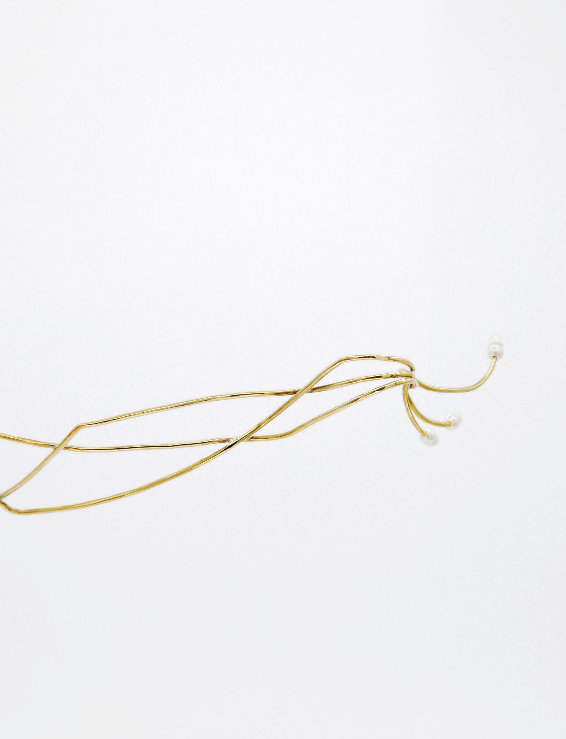 contemporary golden jewelry, shaped for the face to beautify 