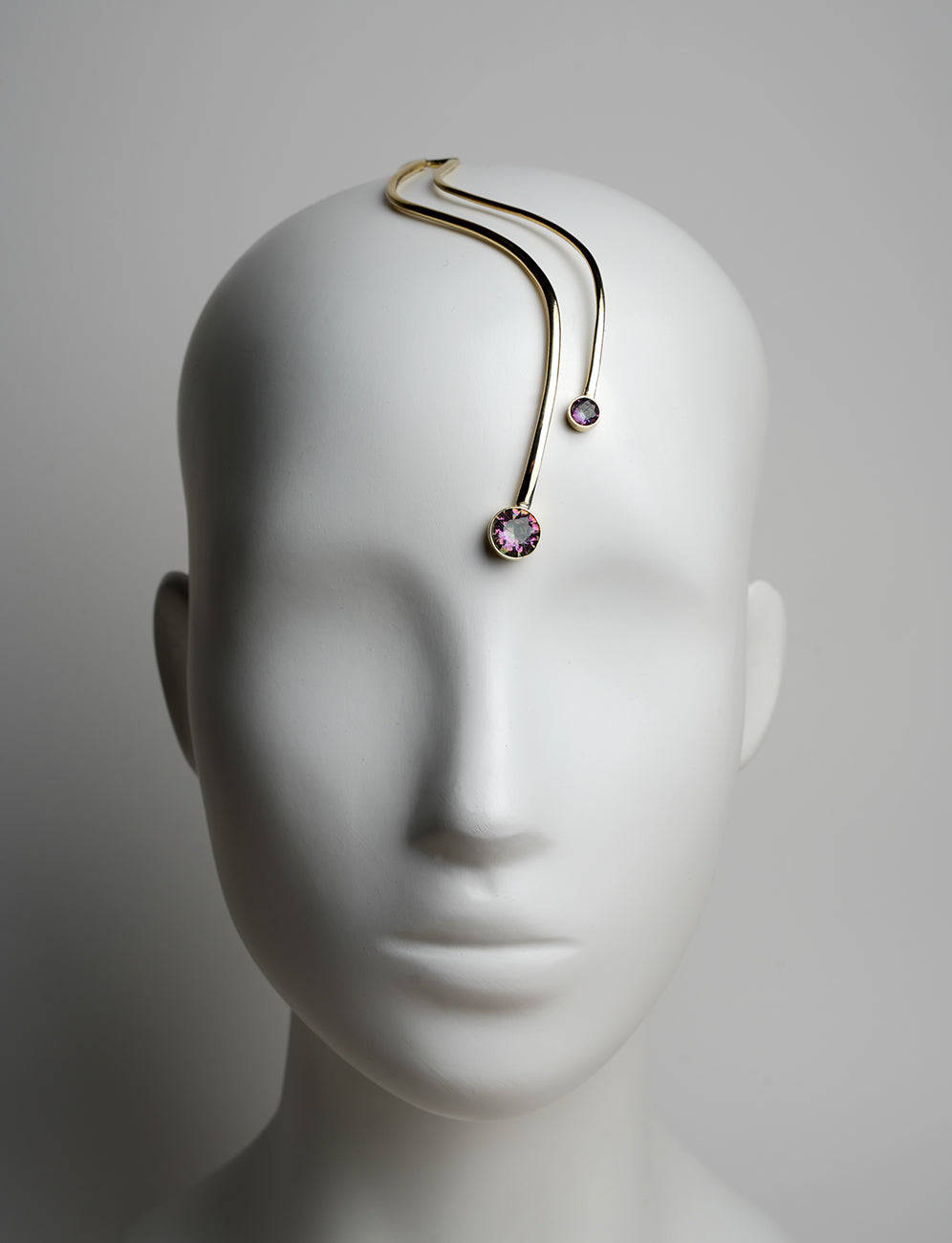 gold headpiece, fashion editorial style with two Beautiful shining rainbow crystals on the forehead