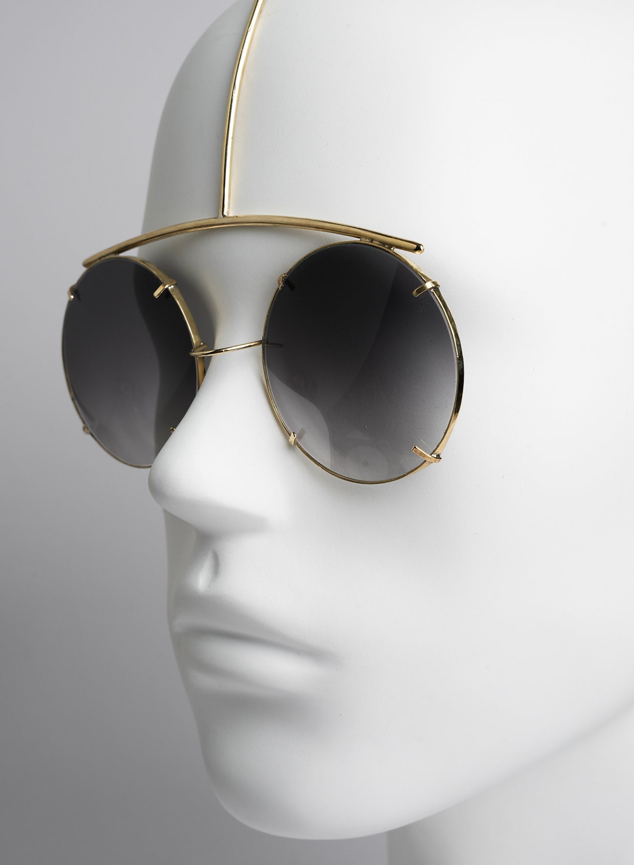 modern and futuristic sunglasses worn like a face jewelry unique piece