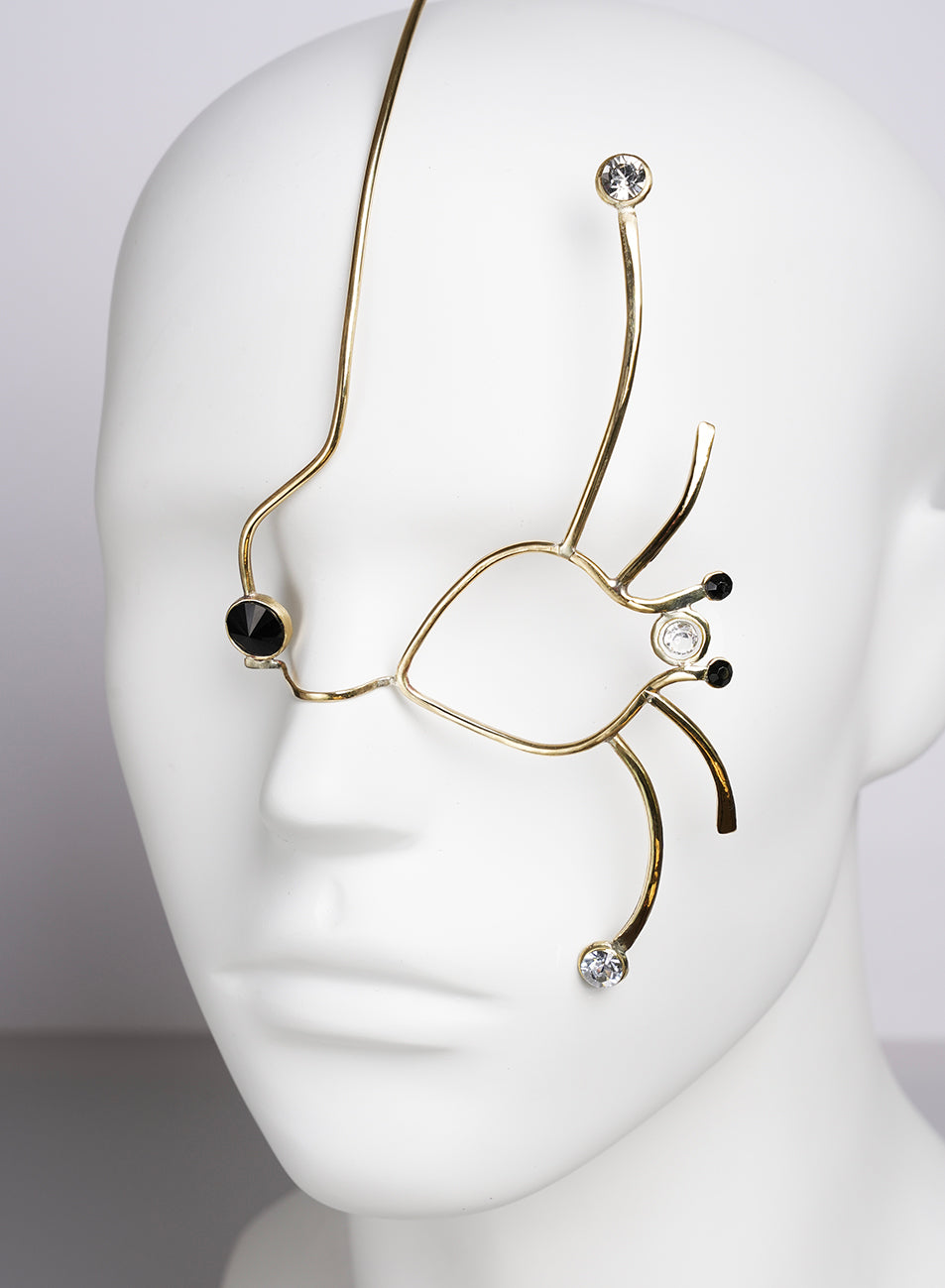 original face jewelry creation, decorating the face and the eyes, gold color with crystals