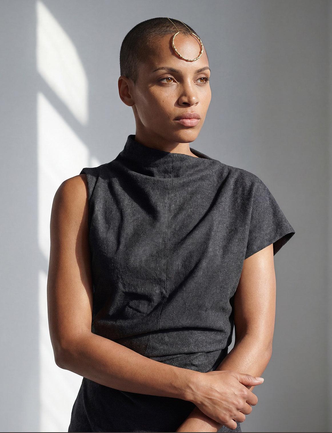 a headpiece that enhances the face with a golden ornament 