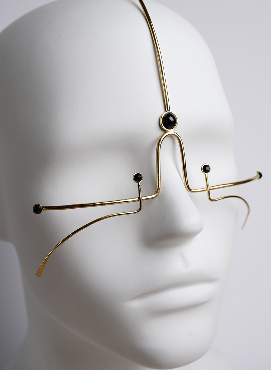 gold headpiece and face jewelry