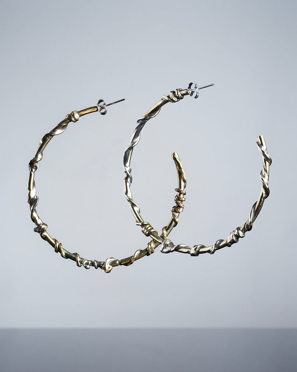 large hoop earrings, golden color with silver, one of a kind