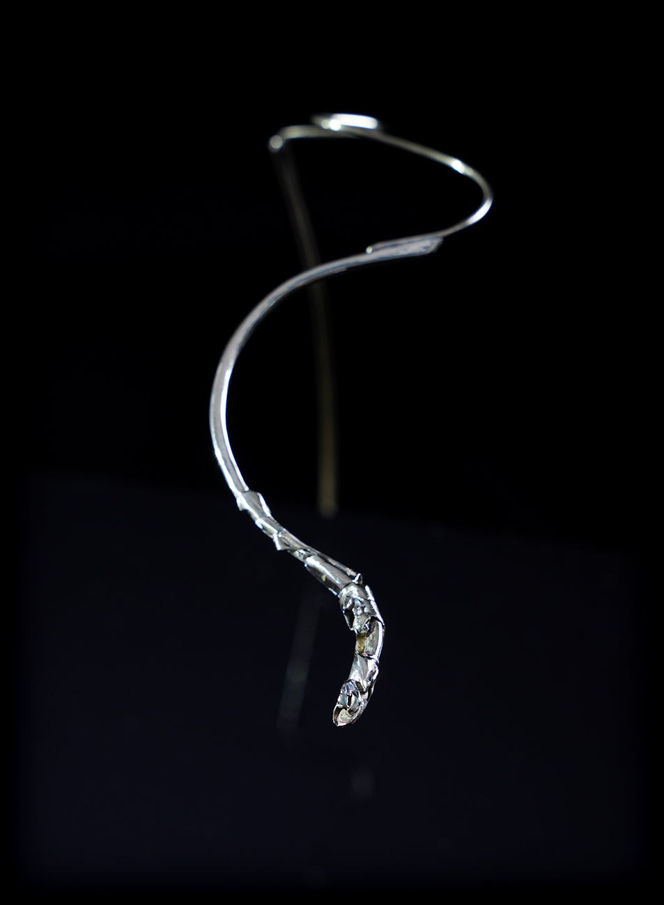 sleek, refined lines, statement face jewelry