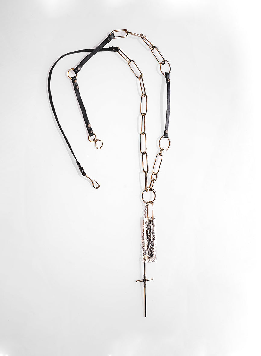 handcrafted jewelry, long necklace made of leather straps, and golden metal
