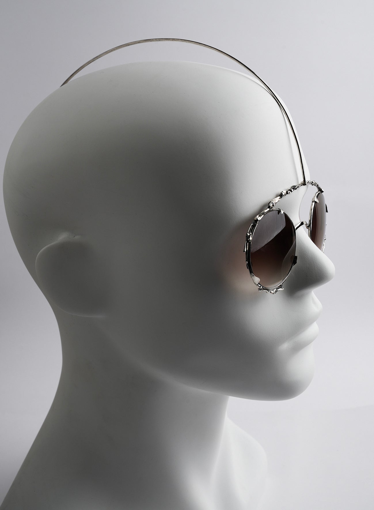 eye wear in silver, like a piece of face jewelry, perfect for unique style and special events