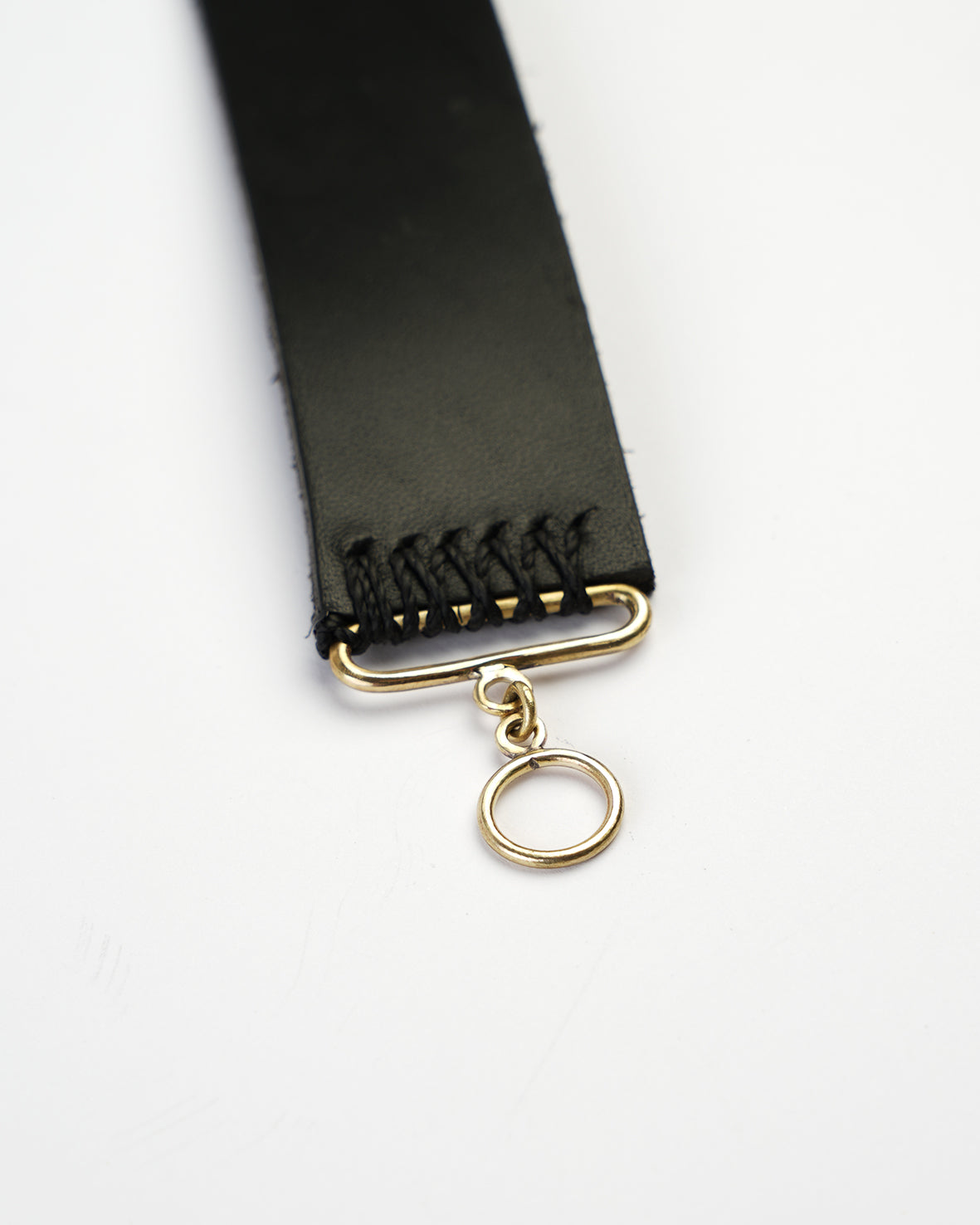 black leather choker with gold cross pendant