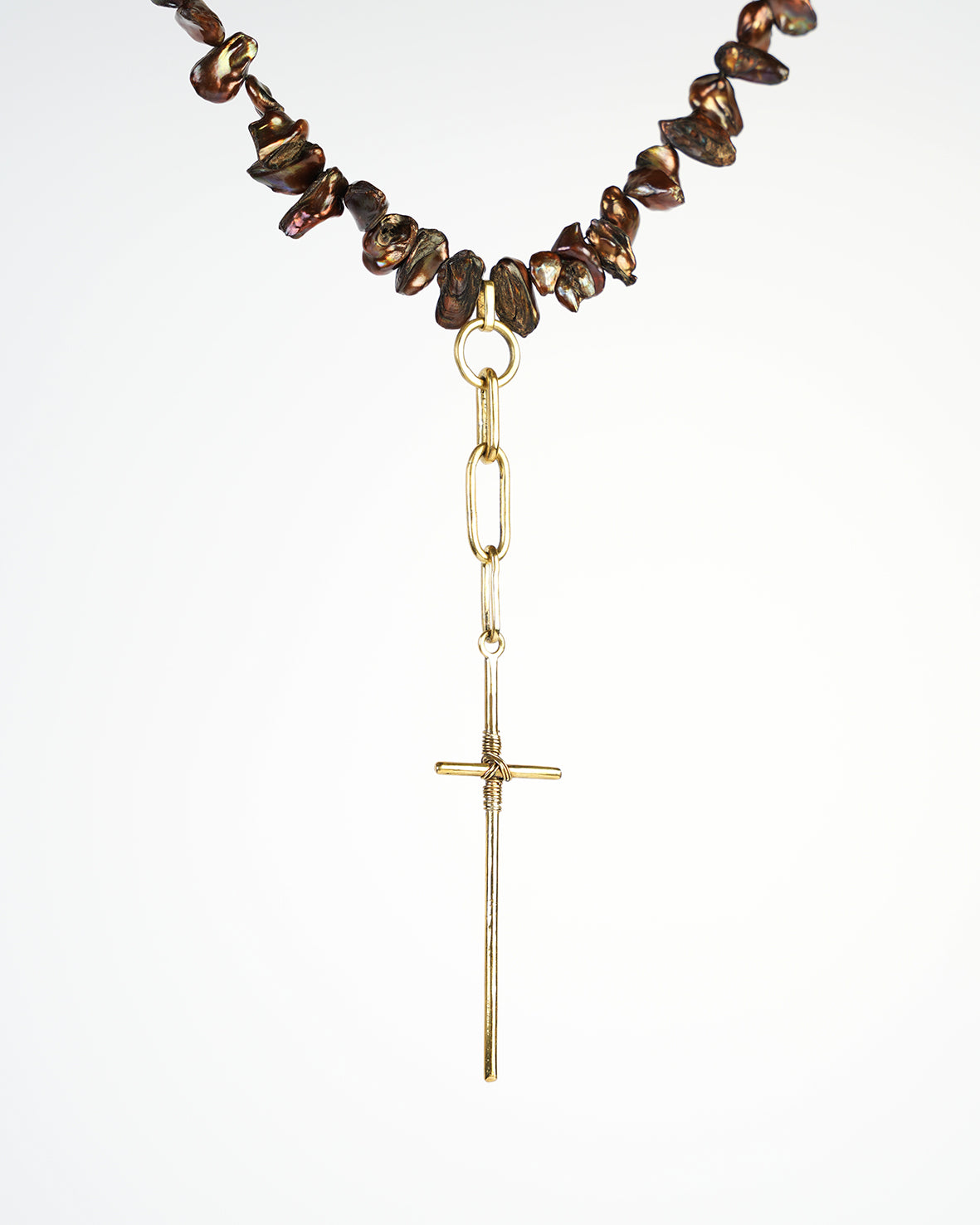 necklace made with natural Keshi pearls and chains. Beatiful handmade cross pendant.