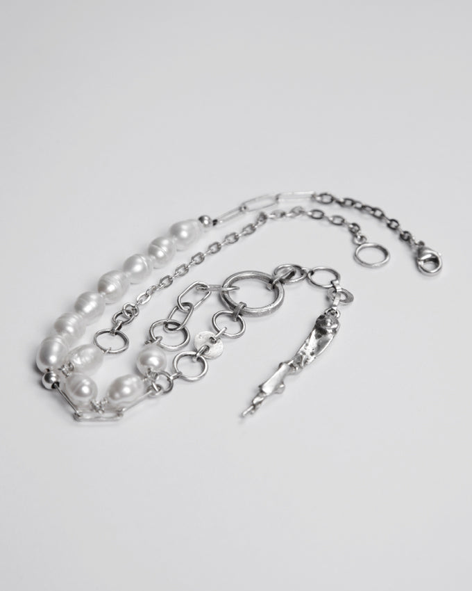Handmade asymmetrical necklace made of silver and natural pearls