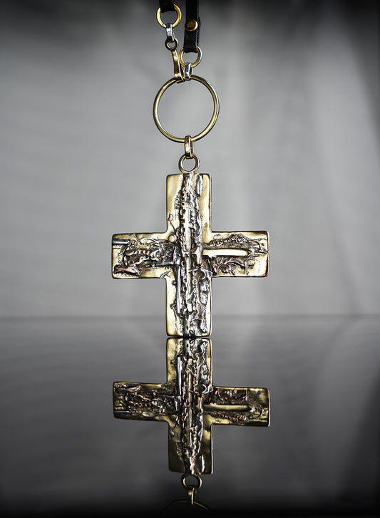 Beautiful necklace, using leather, gold and silver. The cross pendant is a true and unique work of art