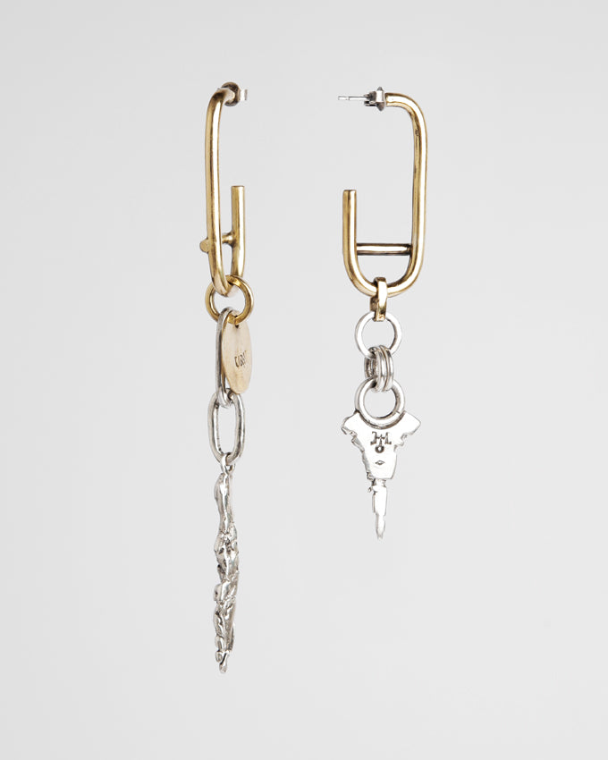 unique pair of asymetrical raw design earrings