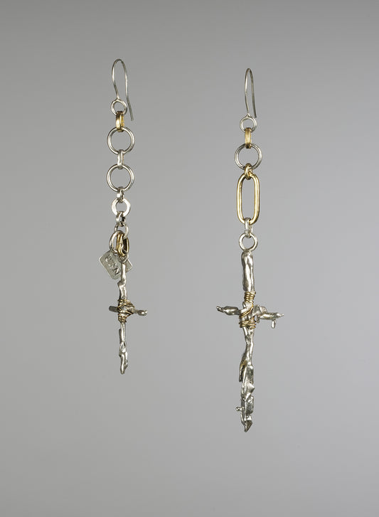 pair of unique asymmetrical  earrings, gold color and silver. 