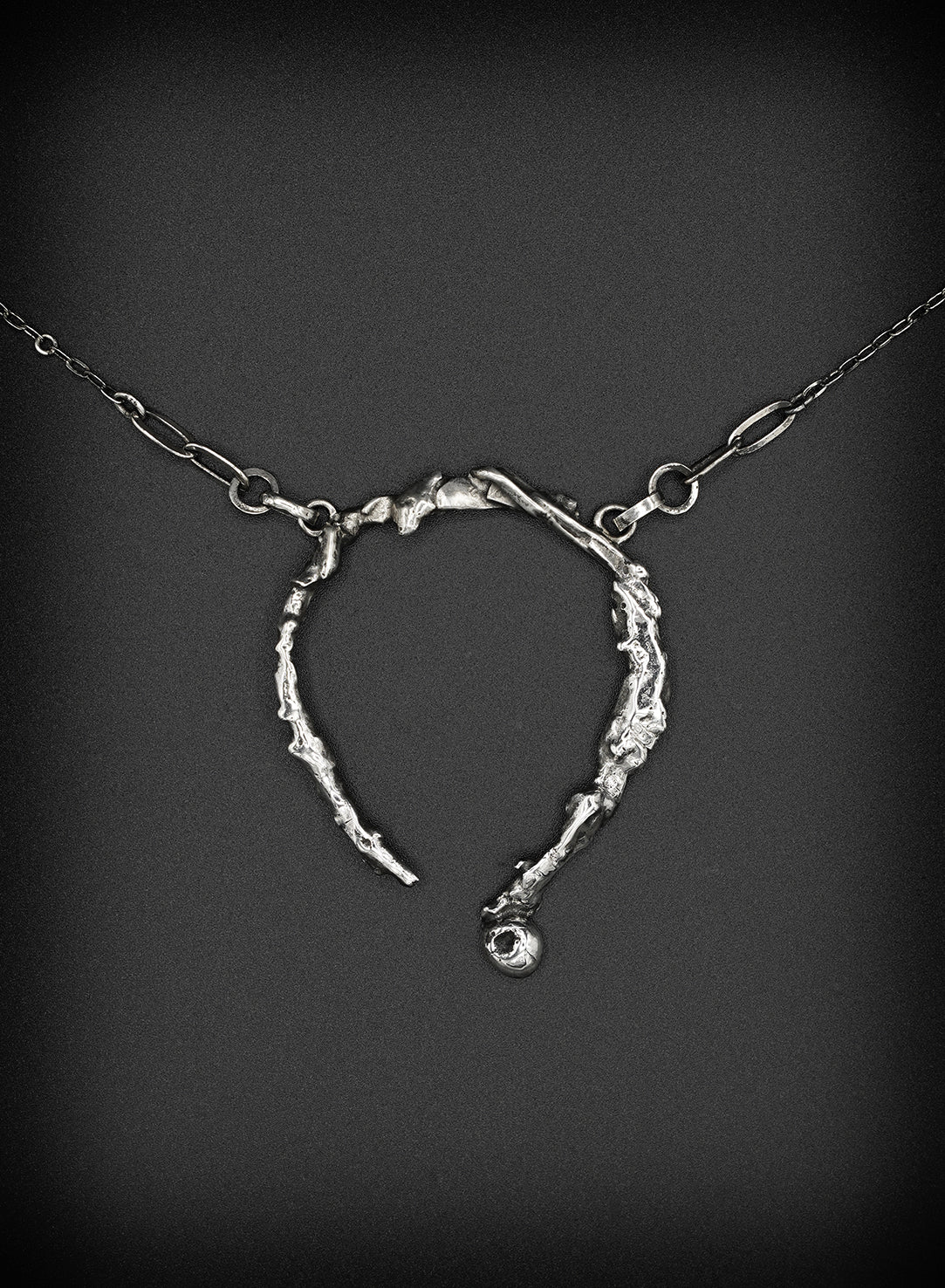 one of a kind silver necklace with a unique pendant sculptured like a work of art