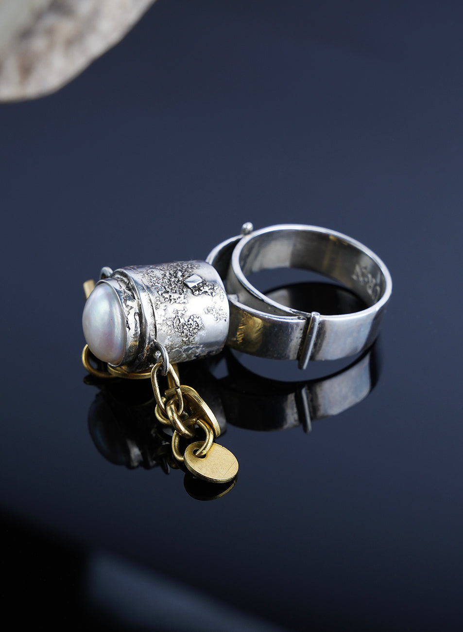 one of a kind ring with pearl and gold chains