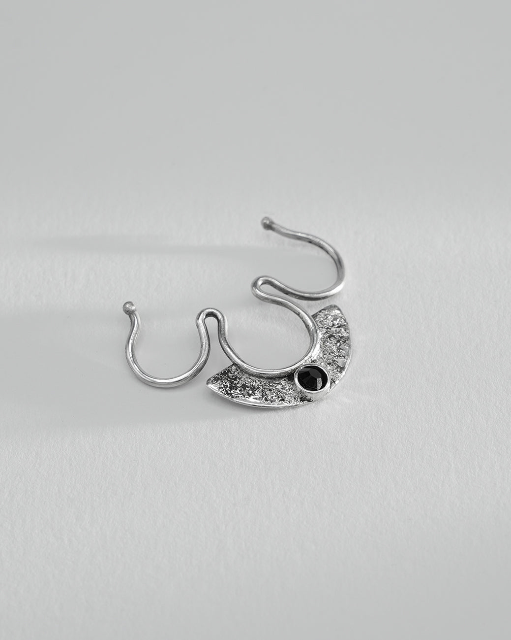 Silver septum ring no piercing, handcrafted metal fusion design with faceted black Swarovski crystal.